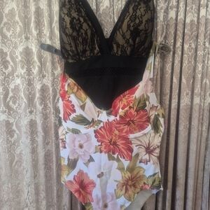 Floral One-Piece Swimsuit and a Black One Piece Swimsuit.